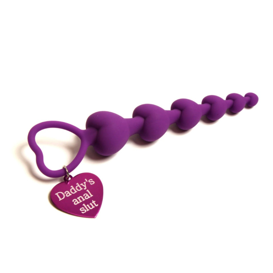 how to use anal beads - purple heart anal beads with daddy's anal slut tag