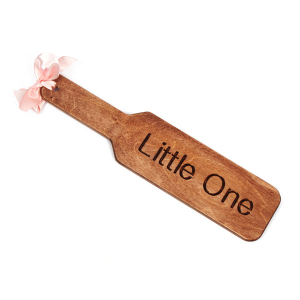 How to use a spanking paddle safely - showing wooden spanking paddle on white background