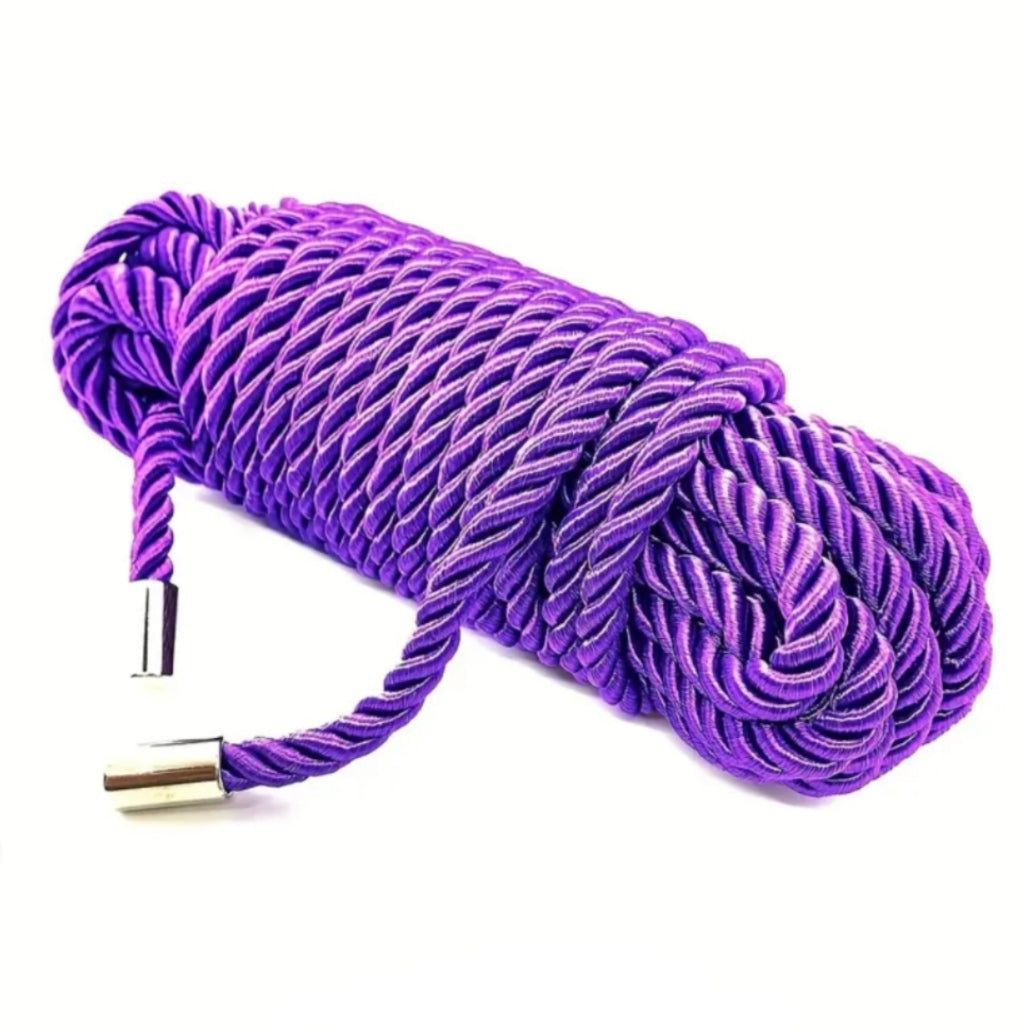 Purple bondage rope on a white background