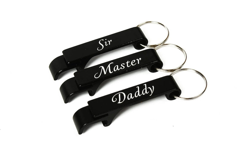 3 keyrings displayed engraved with the words Sir, Master and Daddy on a white background