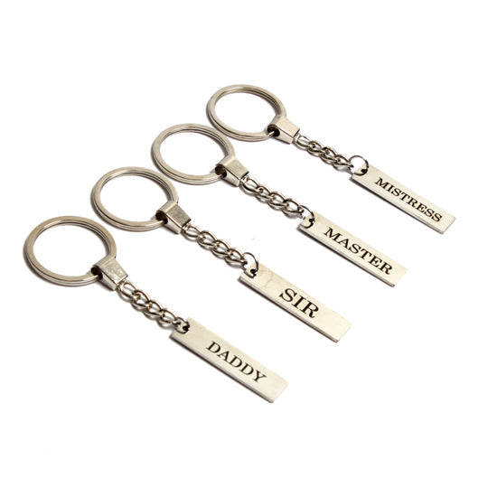 Engraved dominant keyrings with options for Mistress, Master, Sir, and Daddy.