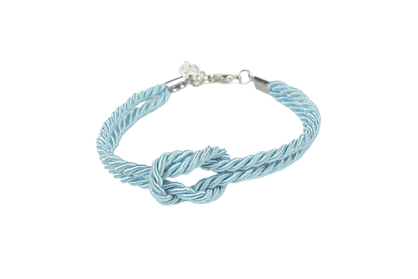 Light blue rope bracelet with overhand knot on white background
