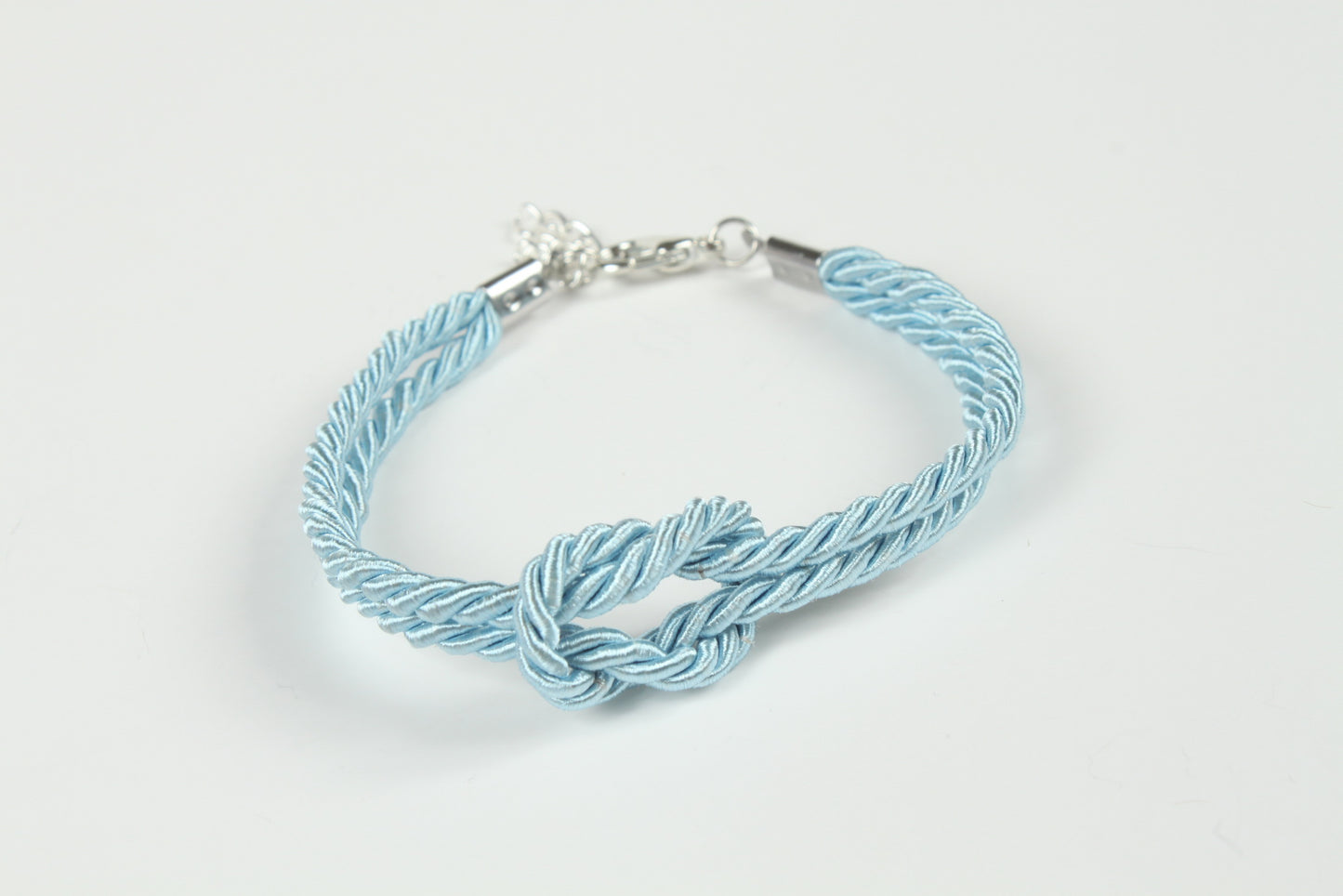 Pastel blue Shibari bracelet with twisted cords and silver clasp