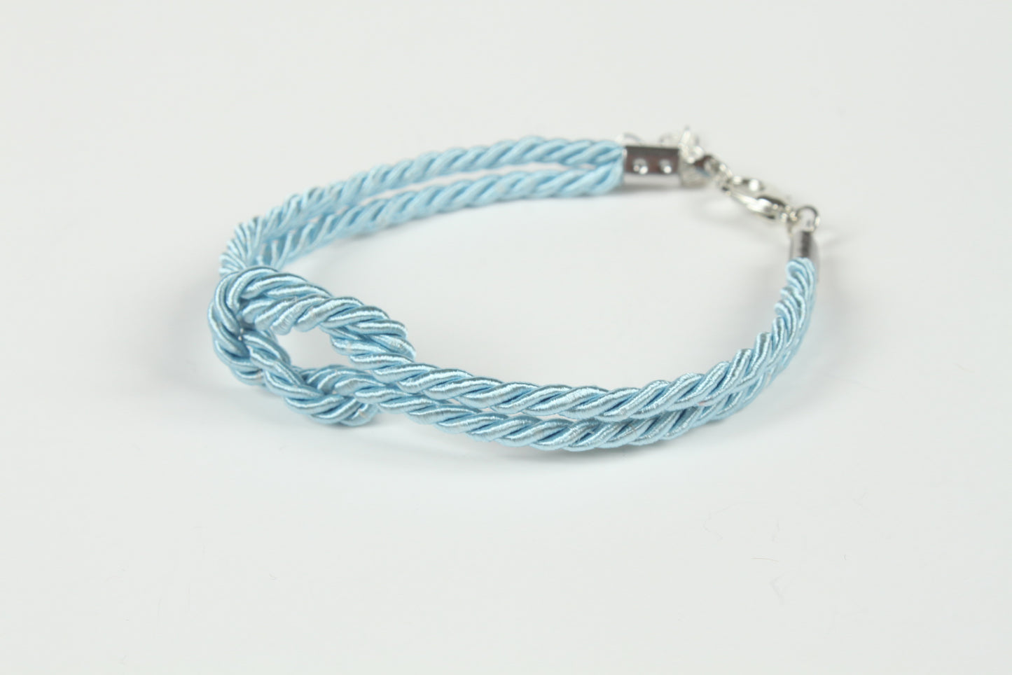Close-up of double twisted cord bracelet with bondage knot