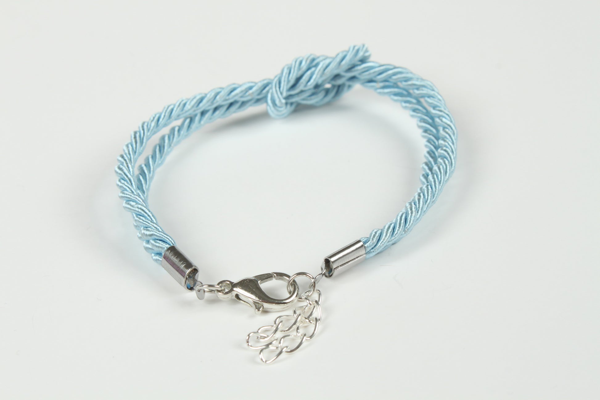 Adjustable blue rope bracelet with satin finish and silver hardware