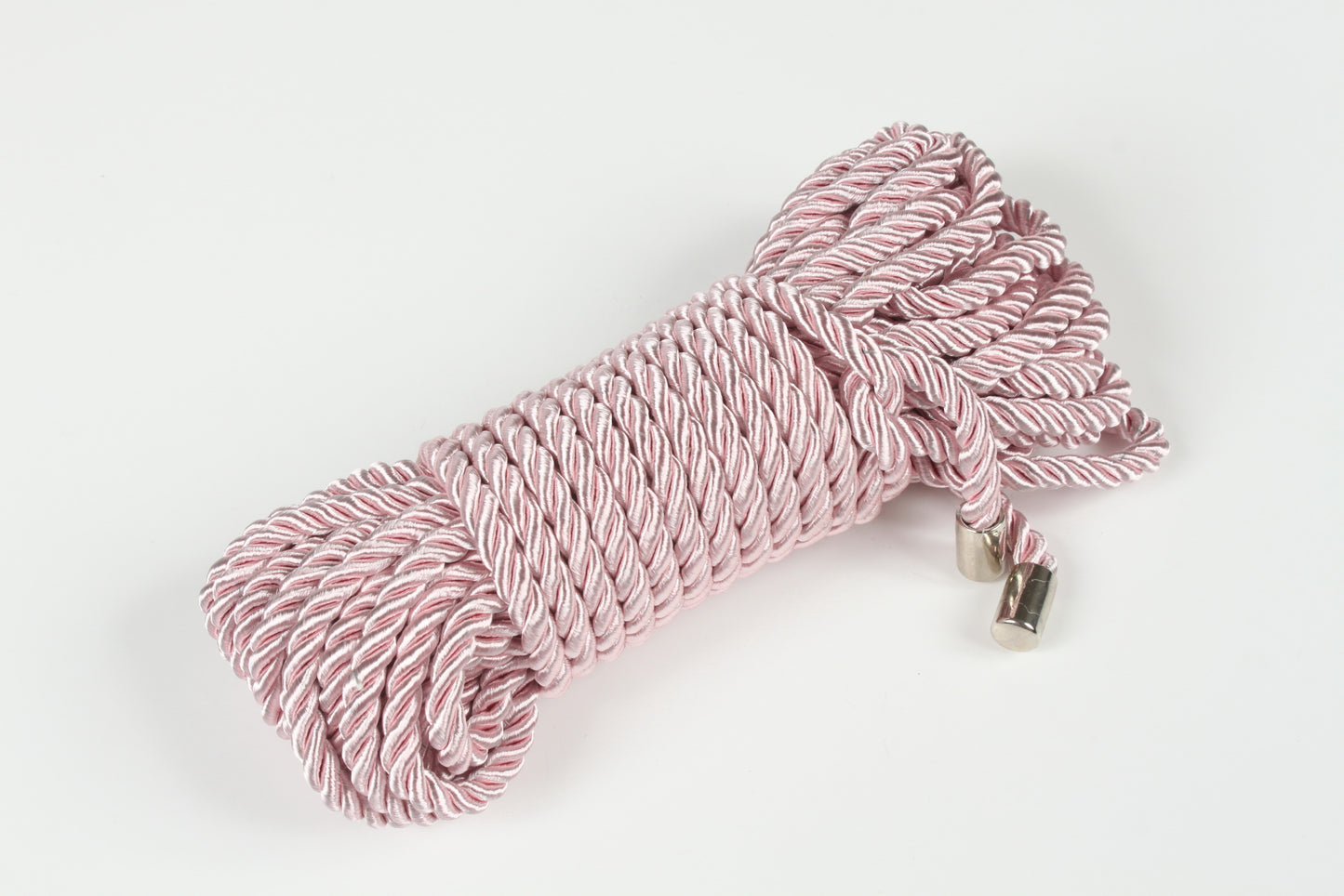 Close-up of pink satin rope designed for rope bondage and kink
