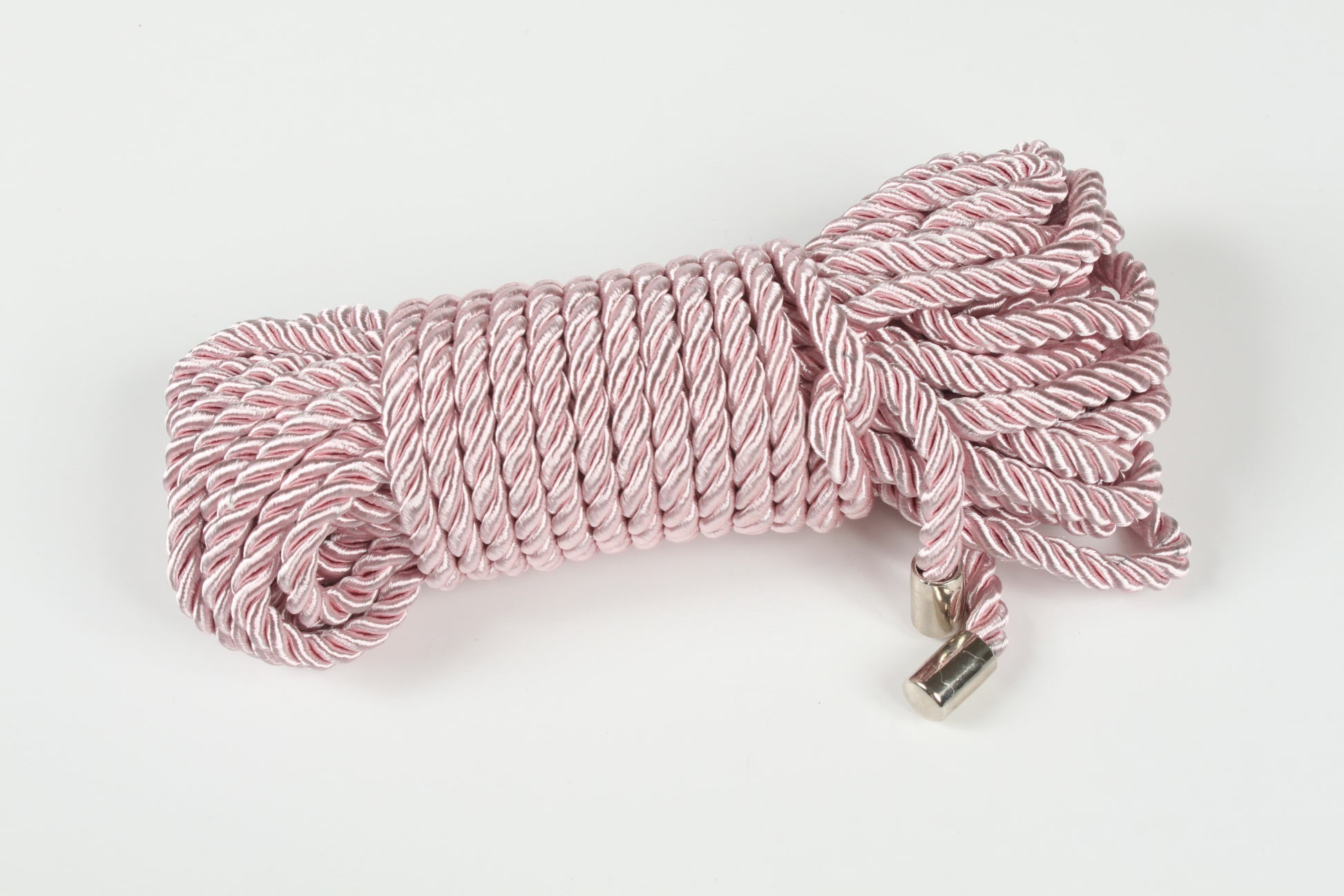 Pink bondage rope with smooth texture and durable metal caps