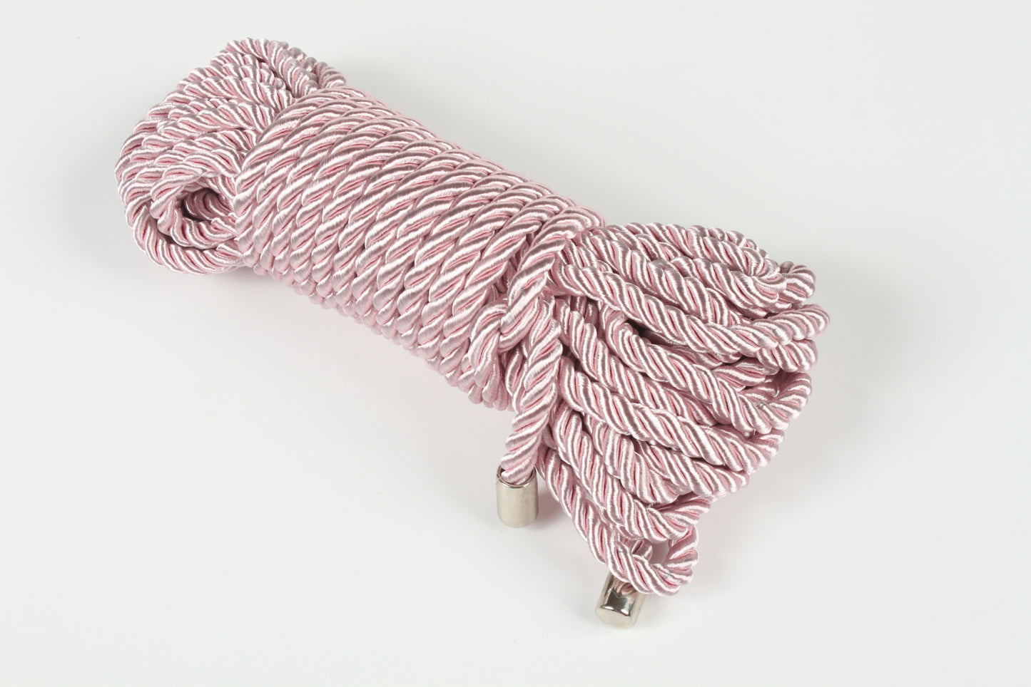 Rope for BDSM and Shibari scenes, coiled and ready for use