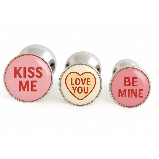 Sweethearts butt plugs inspired by Valentine’s candy hearts. A cheeky and romantic gift with phrases like Kiss Me, Love You, and Be Mine – perfect for Valentine’s Day couples.